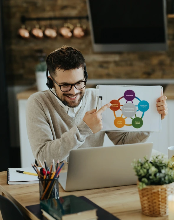 happy-entrepreneur-analyzing-business-chart-web-conference-home